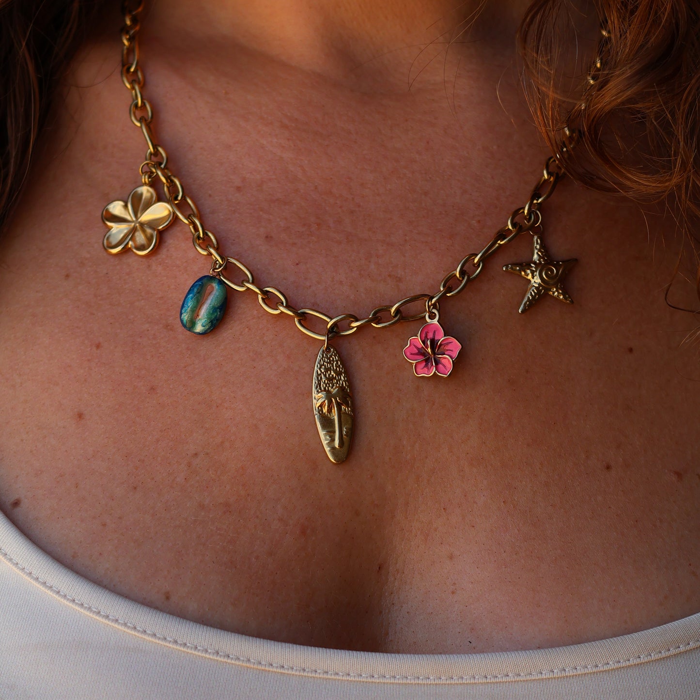 Chunky necklace with surfboard, hibiscus, starfish, plumeria, cowrie, pink, blue and gold
