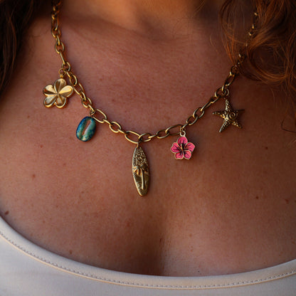 Chunky necklace with surfboard, hibiscus, starfish, plumeria, cowrie, pink, blue and gold